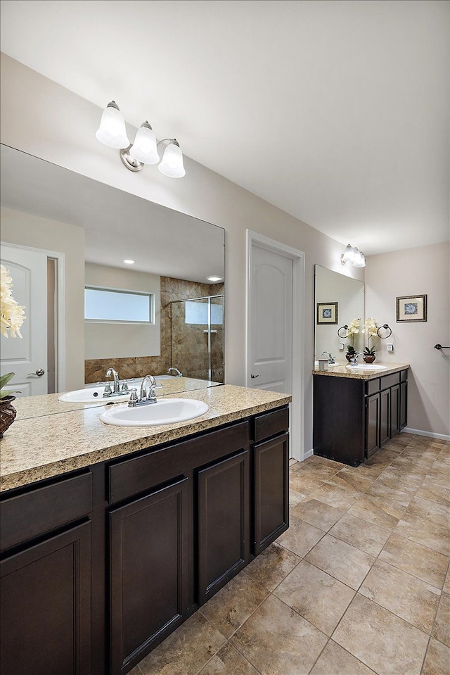5633 Golf Pointe Dr, Clarkston, MI 48348 - bathroom featuring vanity, tile patterned floors, and a shower