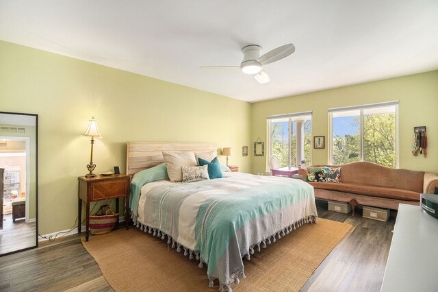 bedroom with wood finished floors and a ceiling fan