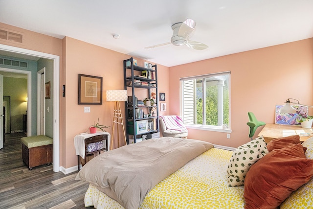 bedroom with baseboards, dark wood finished floors, and ceiling fan