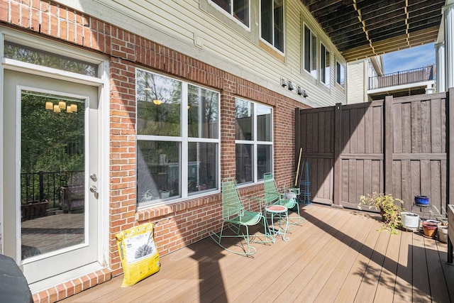 wooden deck featuring fence