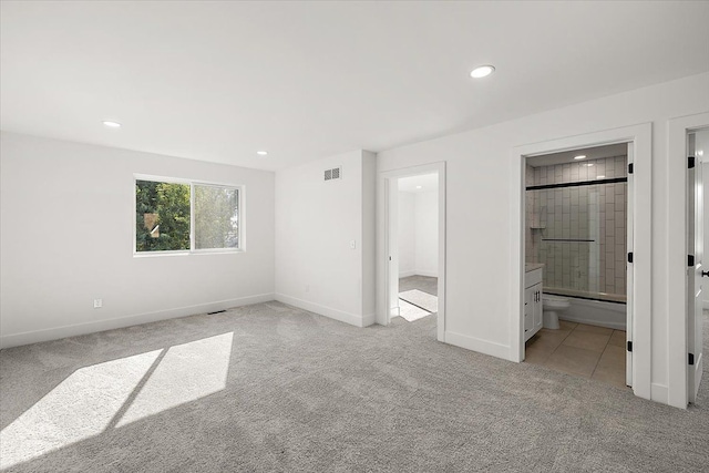 1148 E George Ave, Hazel Park, MI 48030 - unfurnished bedroom with light colored carpet, recessed lighting, baseboards, and connected bathroom
