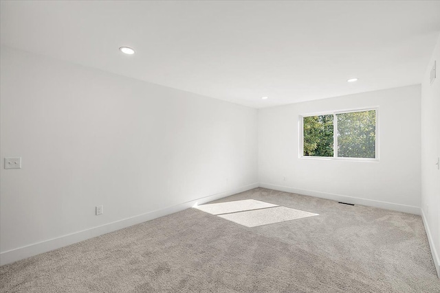 1148 E George Ave, Hazel Park, MI 48030 - spare room with carpet floors, baseboards, and recessed lighting