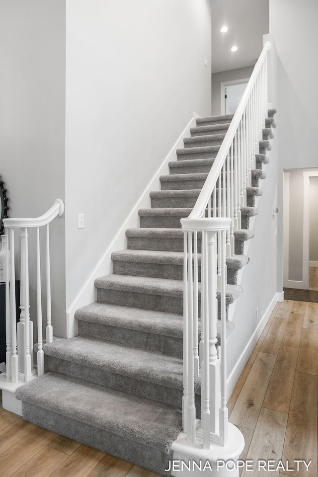 16840 Cricket Ct, Grand Haven, MI 49417 - stairs featuring hardwood / wood-style flooring, baseboards, and recessed lighting