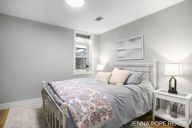 16840 Cricket Ct, Grand Haven, MI 49417 - bedroom with baseboards and wood finished floors