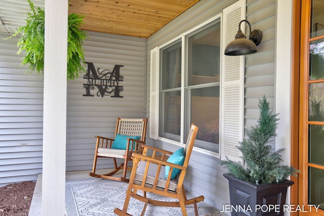16840 Cricket Ct, Grand Haven, MI 49417 - view of patio / terrace with a porch