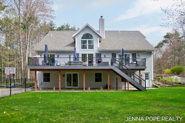 16840 Cricket Ct, Grand Haven, MI 49417 - back of property with a deck, stairway, a chimney, and roof with shingles