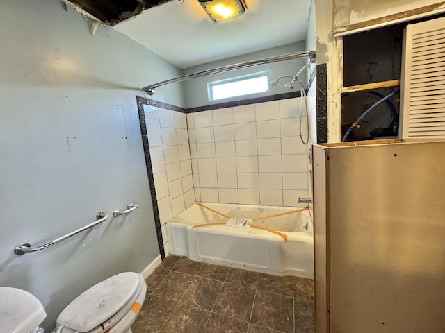 bathroom with toilet and bathtub / shower combination