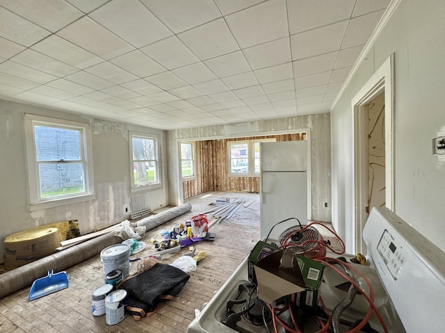 misc room featuring brick patterned floors