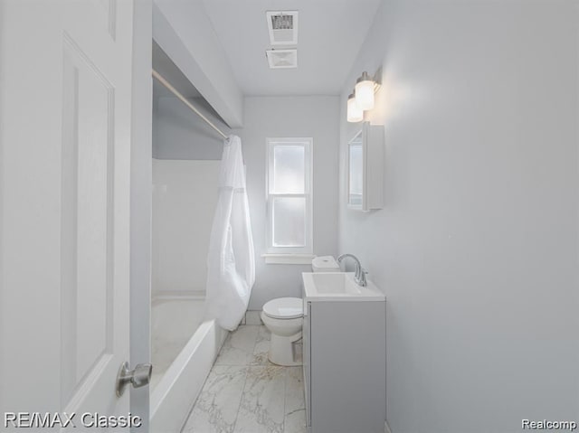full bath featuring marble look tiles, toilet, vanity, shower / bath combo with shower curtain, and baseboards