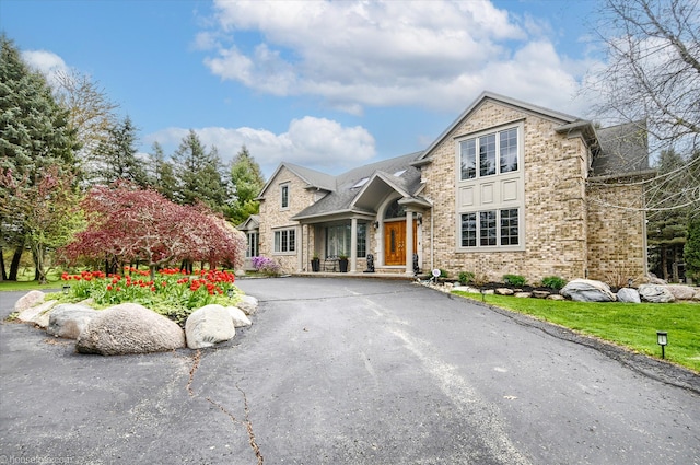 view of front of property featuring stone siding and brick siding