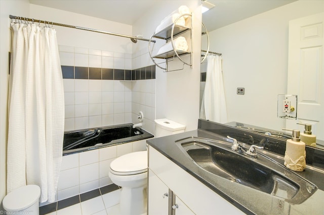 full bathroom with toilet, tile patterned floors, shower / tub combo, and vanity