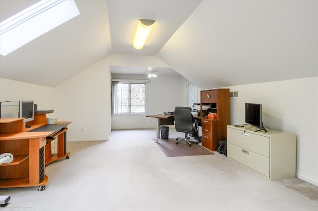 office with lofted ceiling, light carpet, a skylight, and baseboards