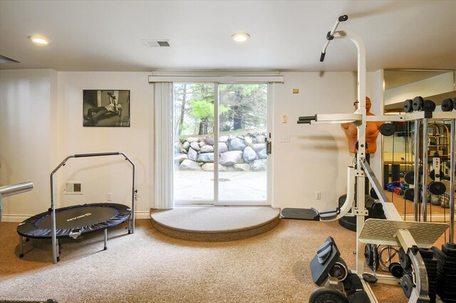 workout area featuring carpet flooring, recessed lighting, and baseboards