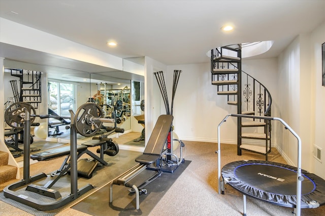 workout area featuring baseboards and recessed lighting