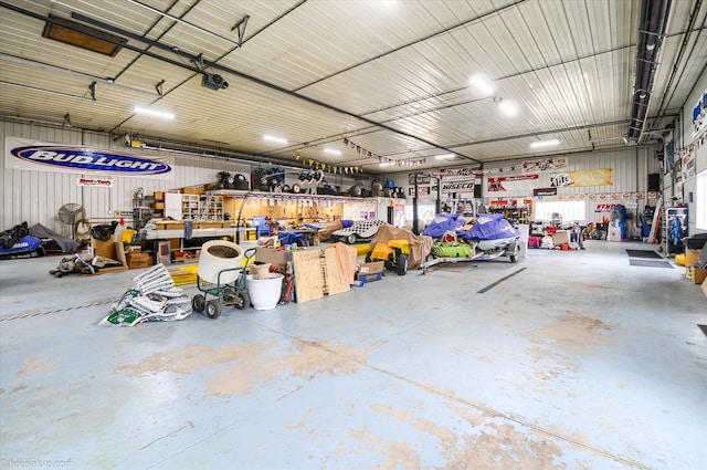 garage featuring a workshop area and a garage door opener