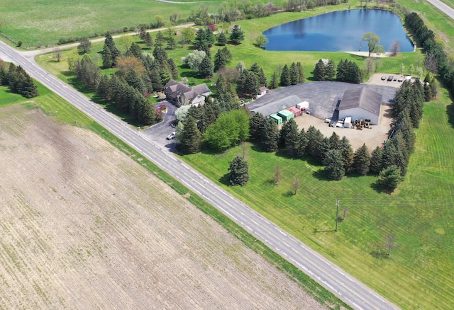 aerial view of property and surrounding area with a large body of water