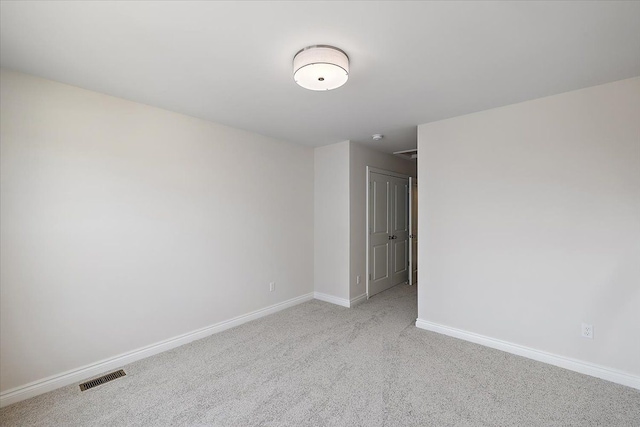unfurnished room with carpet floors and baseboards