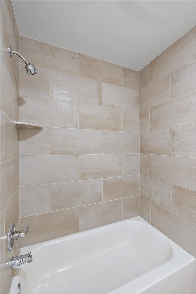 bathroom with shower / bathtub combination