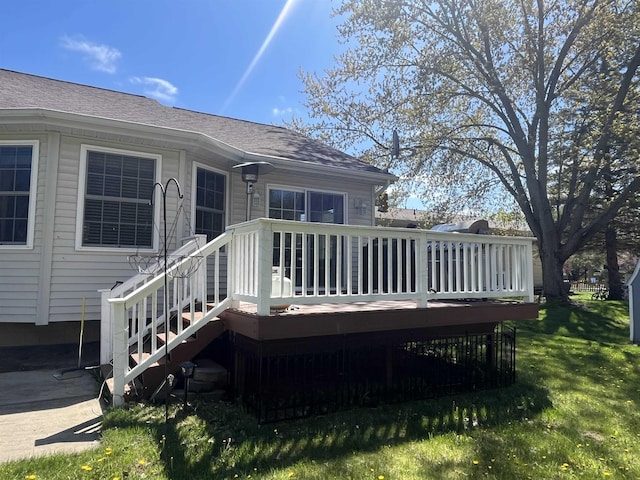 wooden deck with a yard