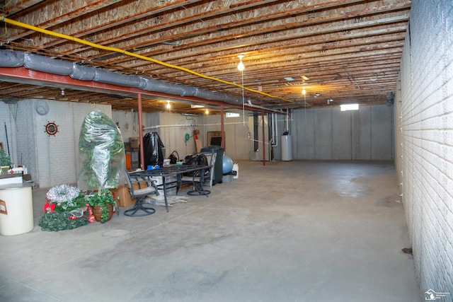 unfinished below grade area with gas water heater and heating unit