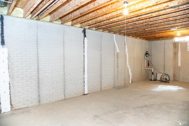 unfinished basement with brick wall