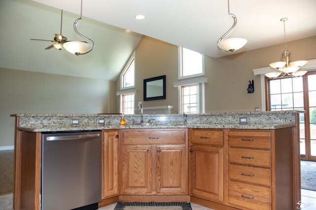 kitchen featuring stainless steel dishwasher, plenty of natural light, a sink, light stone counters, and lofted ceiling