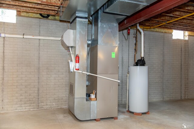 utility room with water heater and heating unit