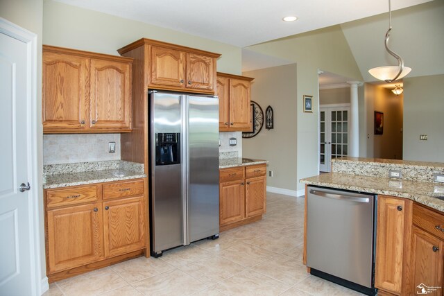 kitchen with appliances with stainless steel finishes, decorative backsplash, brown cabinetry, and recessed lighting
