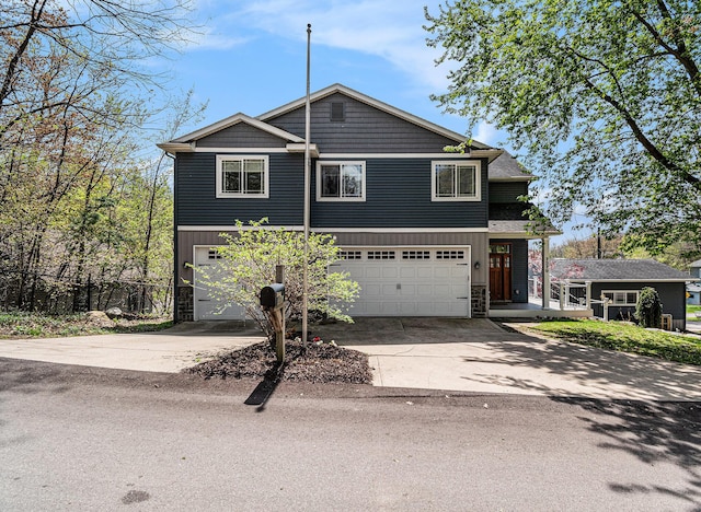 7379 Wimpole Dr NE, Belding, MI 48809 - view of front facade with an attached garage, stone siding, driveway, and fence