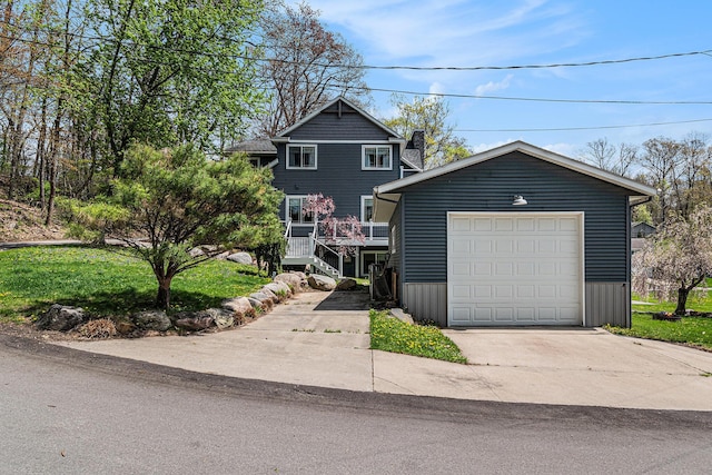 7379 Wimpole Dr NE, Belding, MI 48809 - view of front of home featuring driveway and an outbuilding