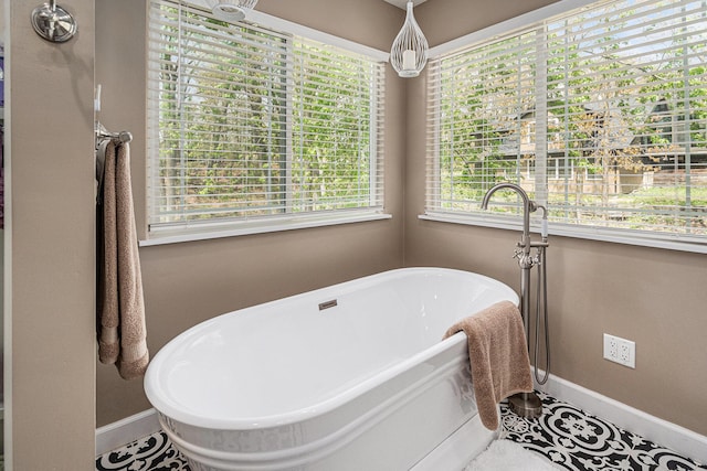 7379 Wimpole Dr NE, Belding, MI 48809 - bathroom with baseboards and a soaking tub