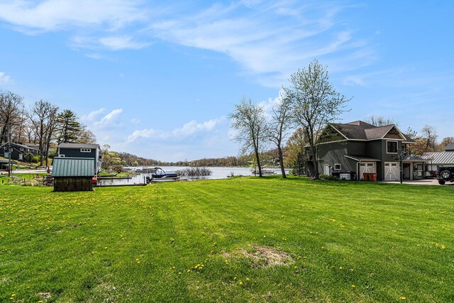 7379 Wimpole Dr NE, Belding, MI 48809 - view of green lawn featuring a water view