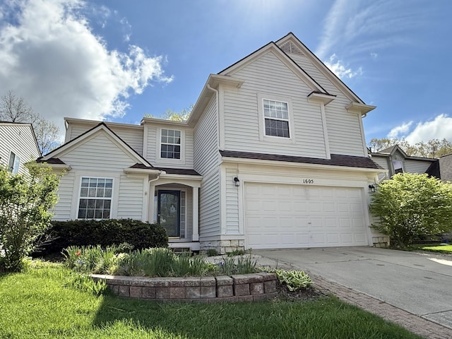 traditional home with a garage and driveway