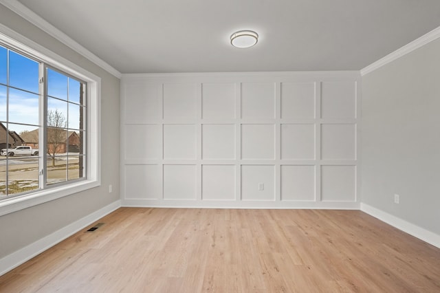 53302 Zachary Dr, Chesterfield, MI 48047 - empty room featuring ornamental molding, light wood-style floors, and baseboards