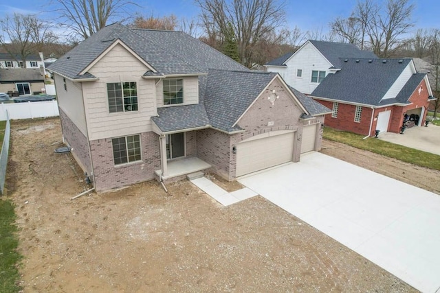 53302 Zachary Dr, Chesterfield, MI 48047 - traditional-style house with a garage, driveway, brick siding, and roof with shingles