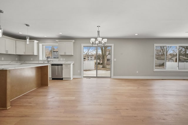 53302 Zachary Dr, Chesterfield, MI 48047 - kitchen with stainless steel dishwasher, recessed lighting, a chandelier, light wood-style flooring, and light countertops
