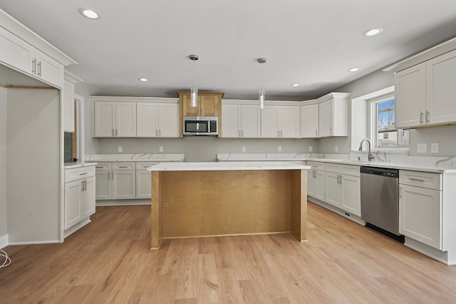 53302 Zachary Dr, Chesterfield, MI 48047 - kitchen with stainless steel appliances, recessed lighting, a sink, light wood-style flooring, and light countertops