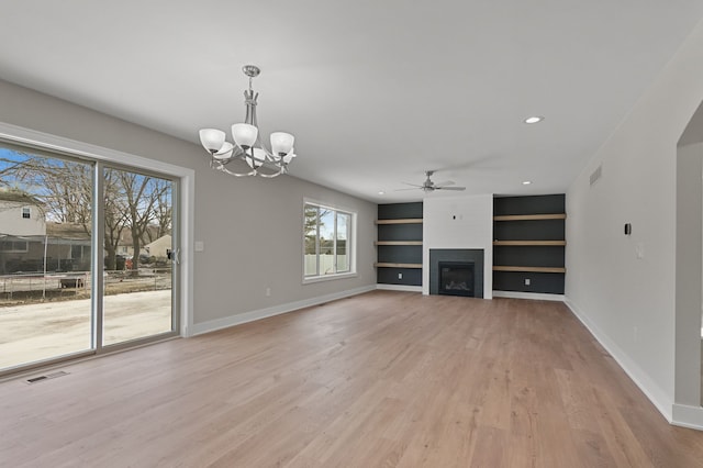 53302 Zachary Dr, Chesterfield, MI 48047 - unfurnished living room with a ceiling fan, light wood-style flooring, baseboards, built in shelves, and recessed lighting