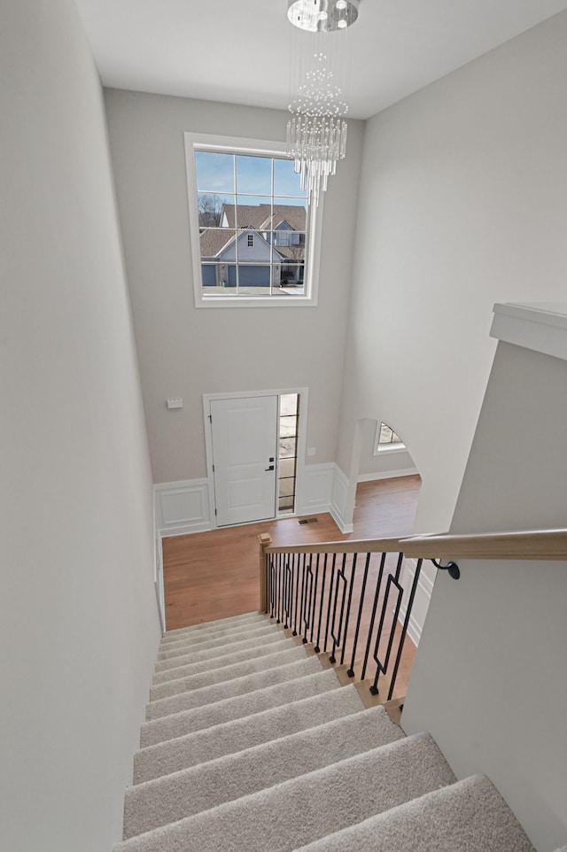 53302 Zachary Dr, Chesterfield, MI 48047 - staircase featuring a chandelier and wood finished floors