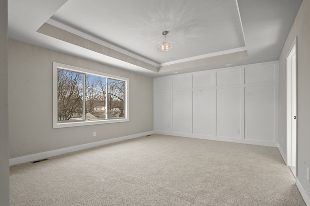 53302 Zachary Dr, Chesterfield, MI 48047 - spare room with a raised ceiling, a chandelier, light colored carpet, and baseboards