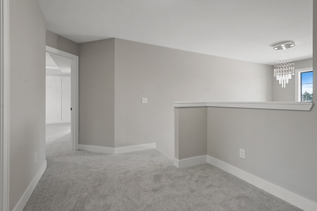 53302 Zachary Dr, Chesterfield, MI 48047 - spare room featuring carpet, a chandelier, and baseboards