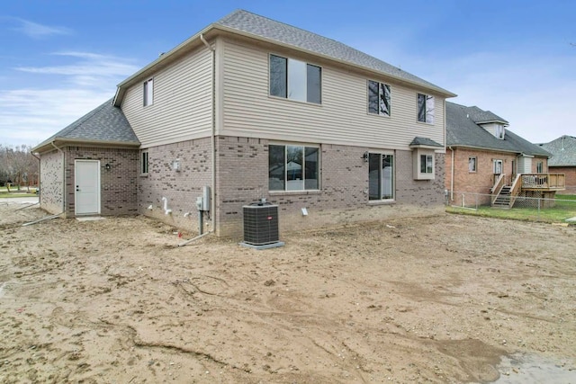 53302 Zachary Dr, Chesterfield, MI 48047 - back of property with brick siding, central air condition unit, and fence