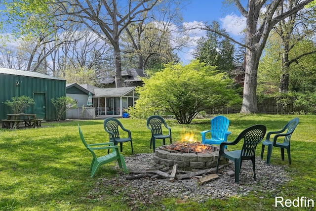 16153 Krob Rd, Union Pier, MI 49129 - view of green lawn with an outdoor fire pit