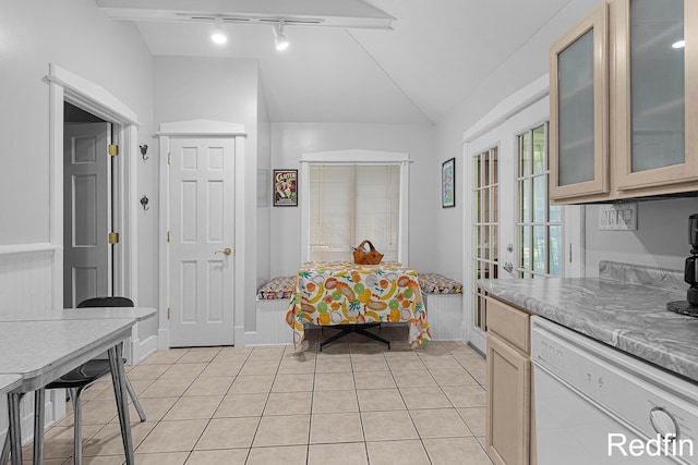 16153 Krob Rd, Union Pier, MI 49129 - dining area featuring rail lighting, lofted ceiling, light tile patterned floors, and baseboards