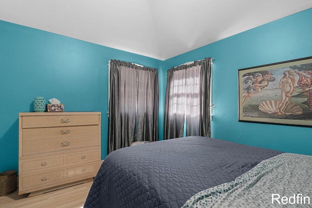 16153 Krob Rd, Union Pier, MI 49129 - bedroom with vaulted ceiling and light wood-type flooring
