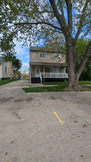 19205 Stanley St, Melvindale, MI 48122 - view of front of house with covered porch and uncovered parking