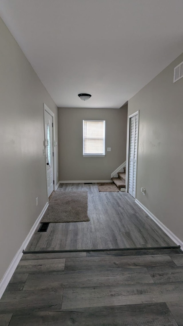 19205 Stanley St, Melvindale, MI 48122 - foyer entrance with stairway, wood finished floors, and baseboards
