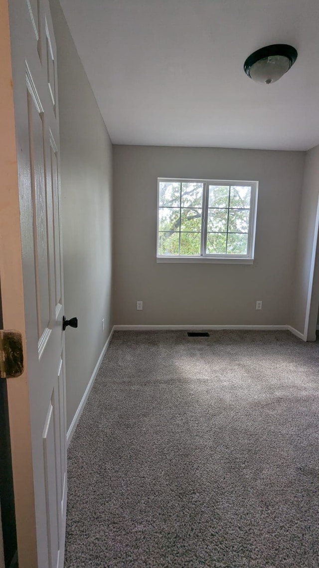 19205 Stanley St, Melvindale, MI 48122 - carpeted empty room featuring baseboards