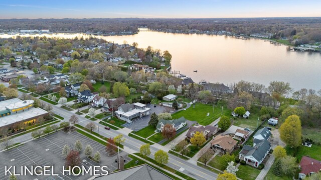 223 E Savidge St, Spring Lake, MI 49456 - aerial view of property and surrounding area with a nearby body of water and nearby suburban area
