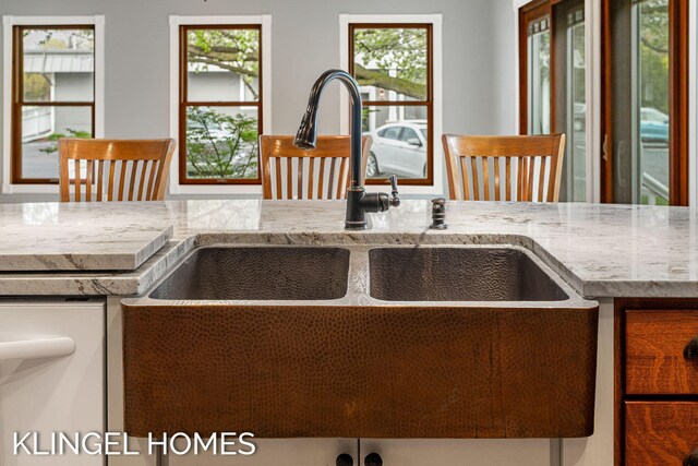 223 E Savidge St, Spring Lake, MI 49456 - kitchen with a sink, healthy amount of natural light, and light stone countertops